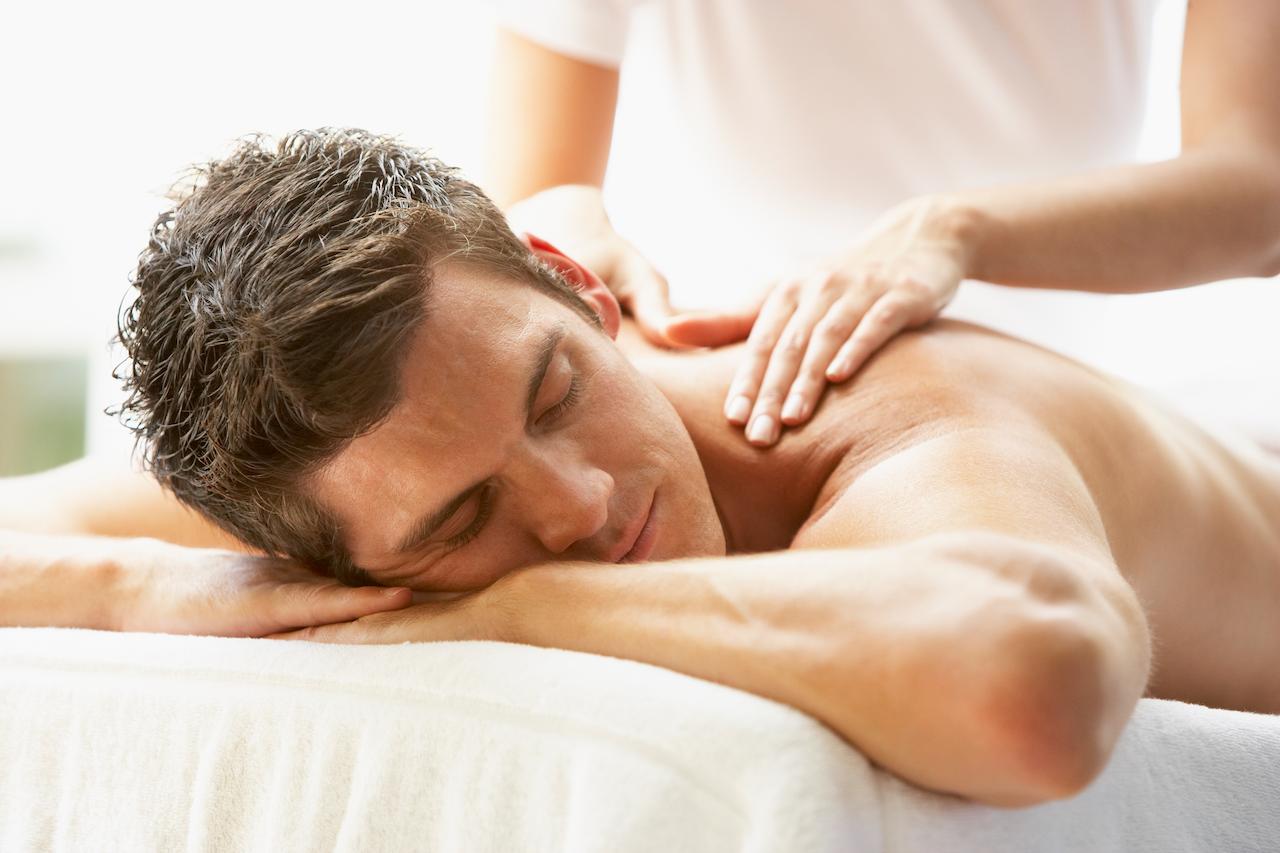 Man Enjoying Massage At Spa.